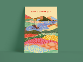 Postkarte "Have a Sunny Day" – Creme mit Sommer-Badeszene und bunter Wiesenlandschaft